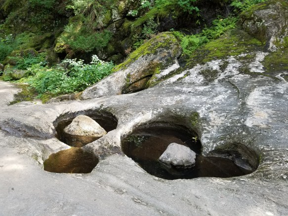 Potholes in the rocks at the Natural Stone Bridge and Caves